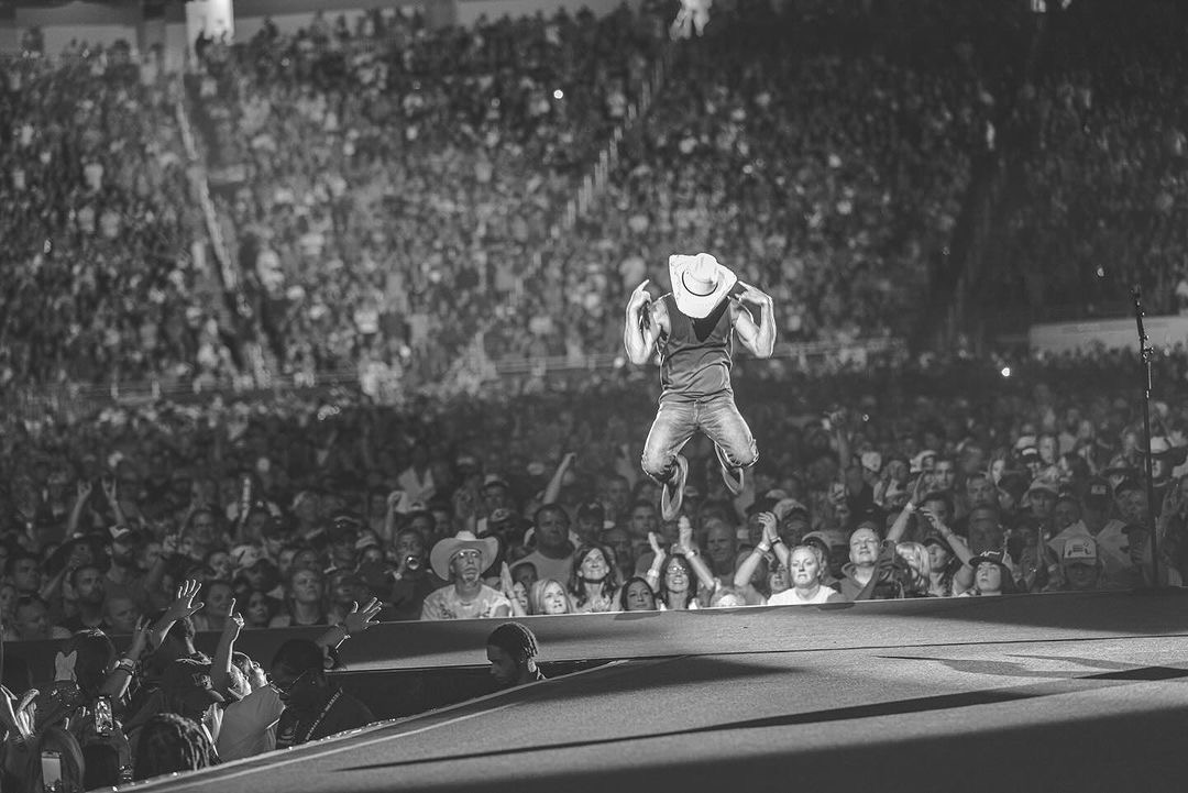 Kenny Chesney live in front of a large crowd